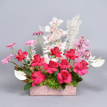 Roses & Smiles, Blooms of Joyful Elegance, White Cymbidium Flower, Pink Cymbidium Flower, Gerbera Flower, Anthurium Flower, Hydrangea Flower, Palm Jaht Dried Flower, Ruscus Dried Flower, Dark Pink Roses, Acrylic Box